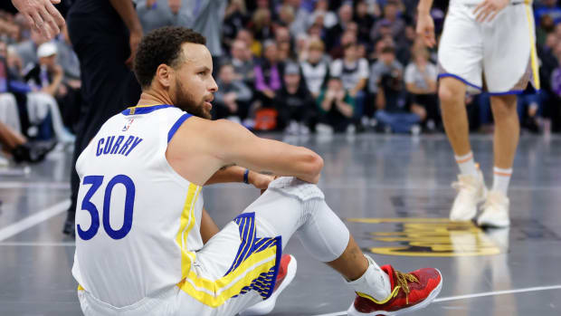 Golden State Warriors guard Steph Curry reacts to a play against the Sacramento Kings.